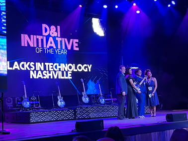 Photo of Holly Rachel and Lena Winfree of BiT Nashville accepting their award for D&I Initiative of the Year  at the NTC Awards via the NTC's Twitter. 